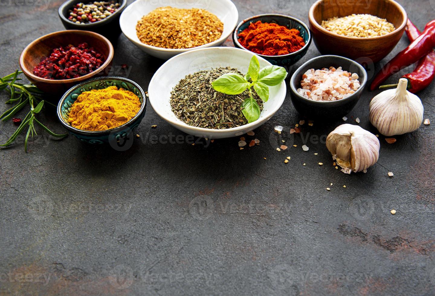 Various spices on a black background photo