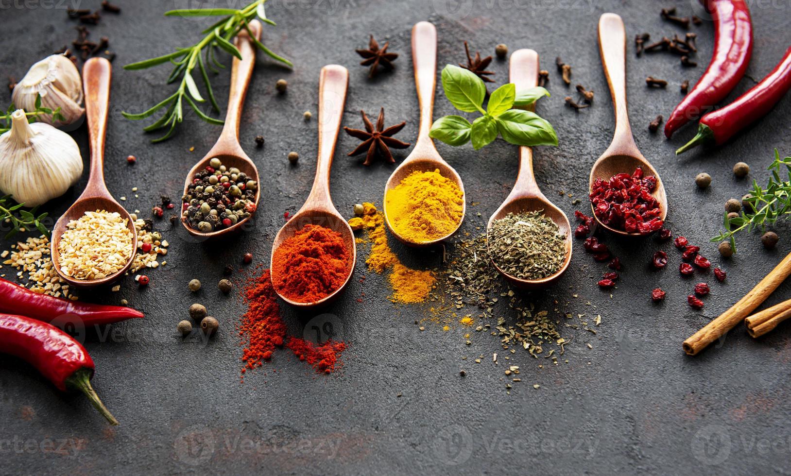 Assortment of spices on black photo