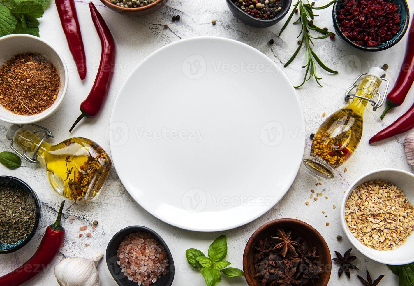 Empty plate and frame of spices photo