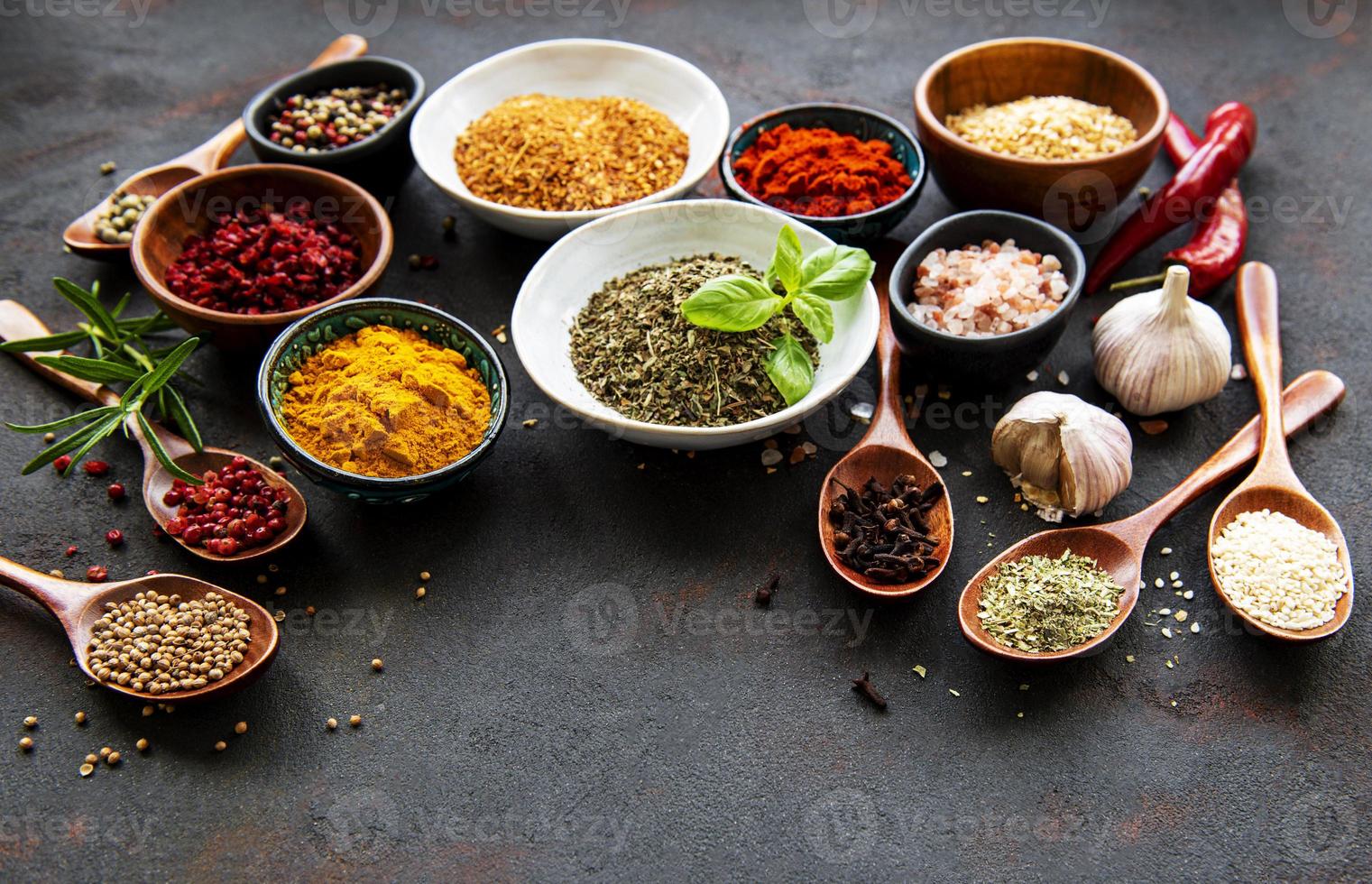 Various spices on a black background photo