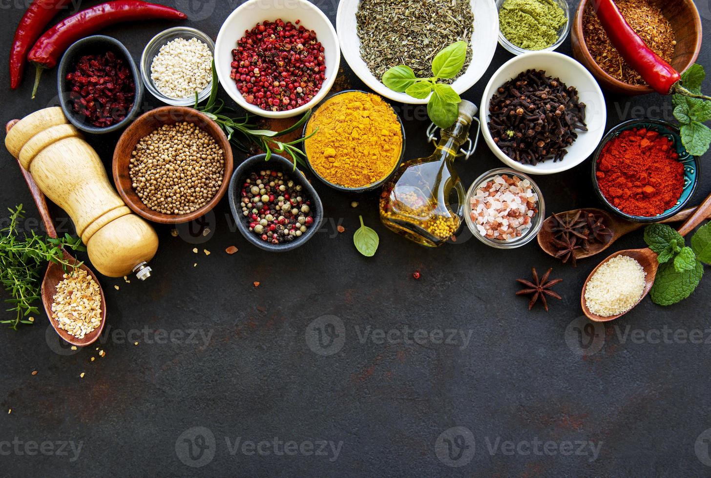 Assortment of spices on black photo