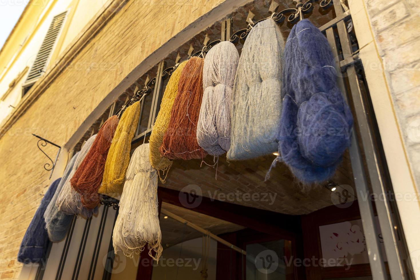 Skeins of cashmere hanging on a shop photo