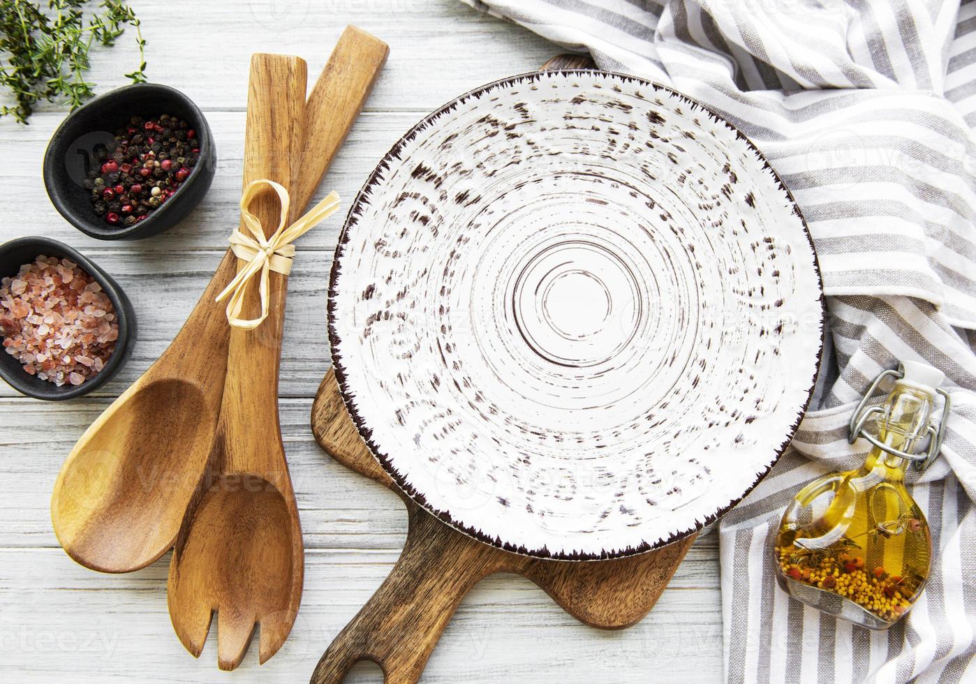 Empty plate on a wooden table photo