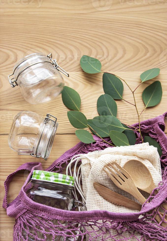 Mesh bag, cotton bags and glass jars photo