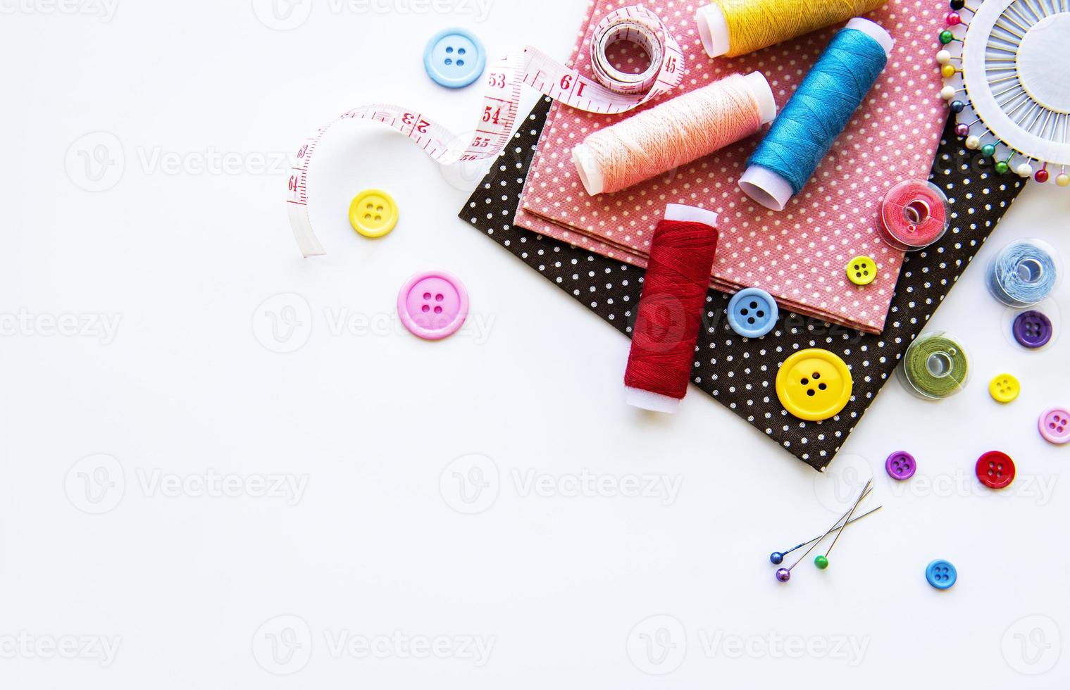 Sewing accessories on a white background photo