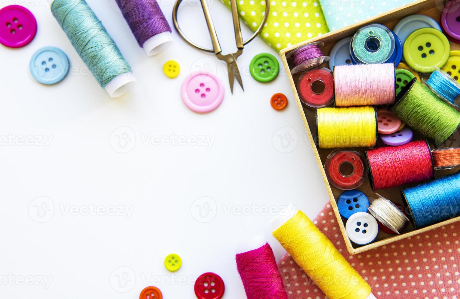 Sewing accessories on a white background photo