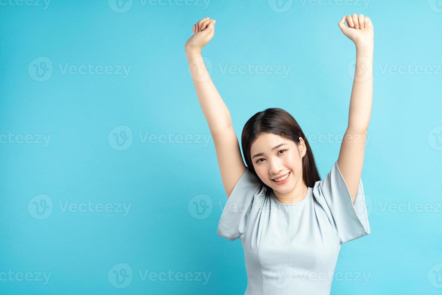 Asian woman showing feelings of triumph photo