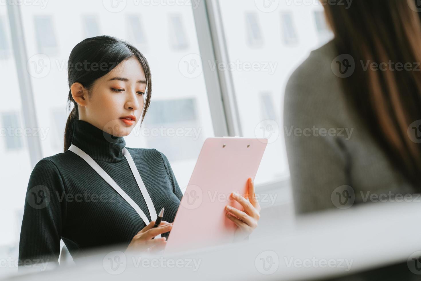 The recruitment officer is interviewing the candidate photo