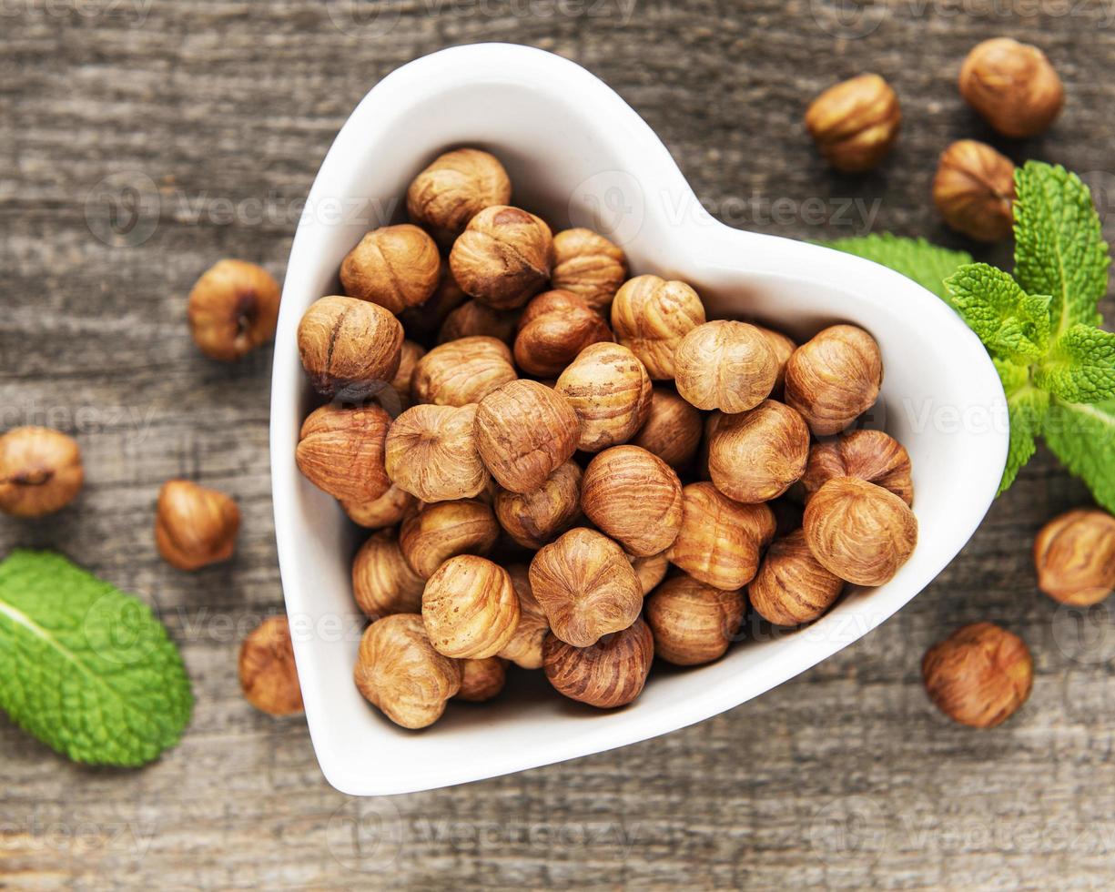 Bowl with Peeled hazelnuts photo