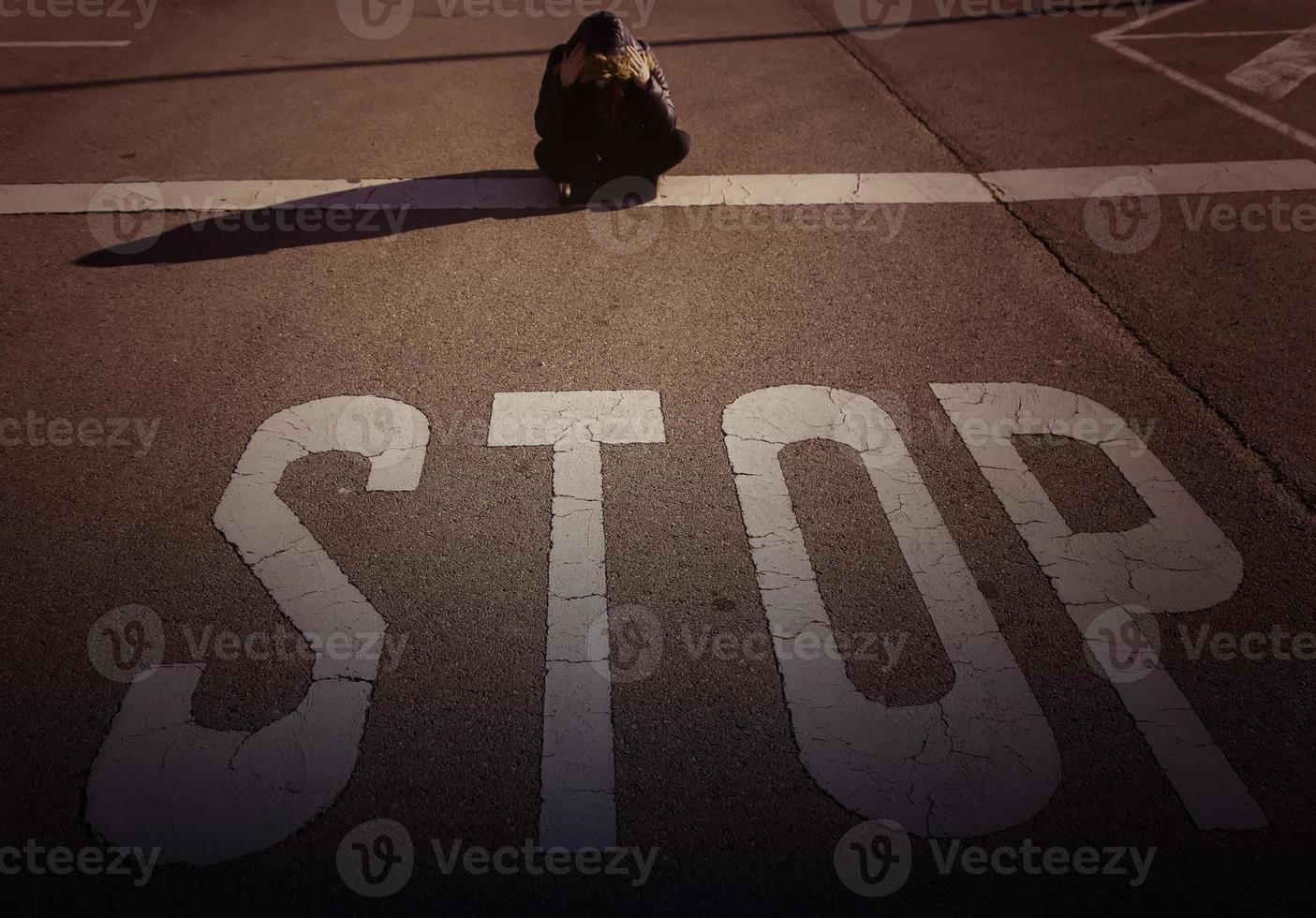 Woman at stop sign photo