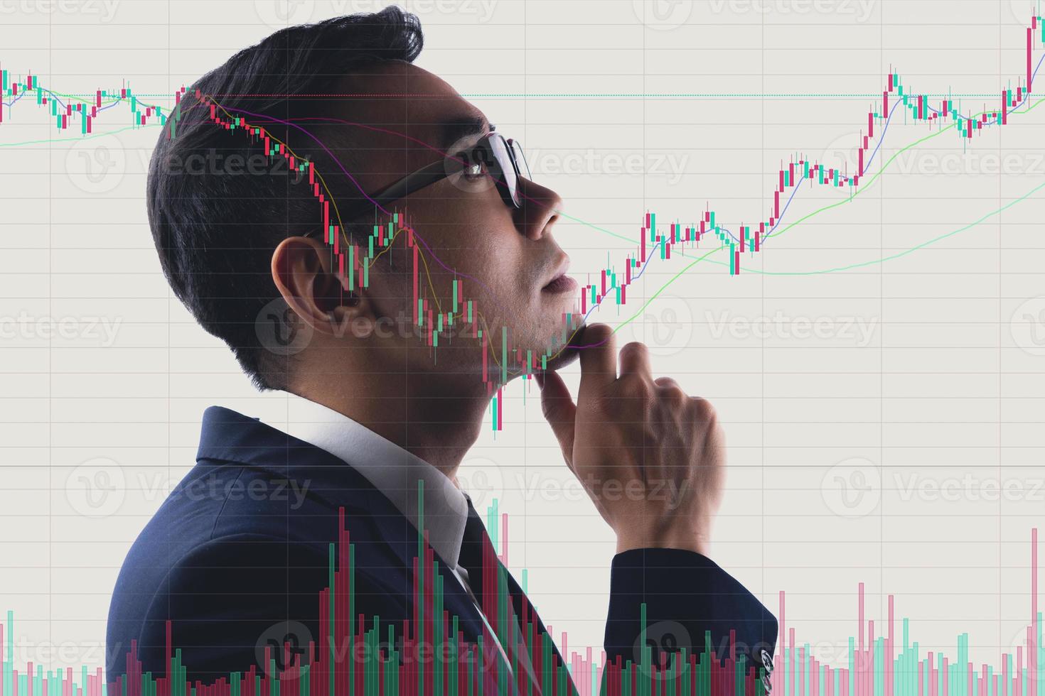 Portrait of Asian businessman studying stock market photo