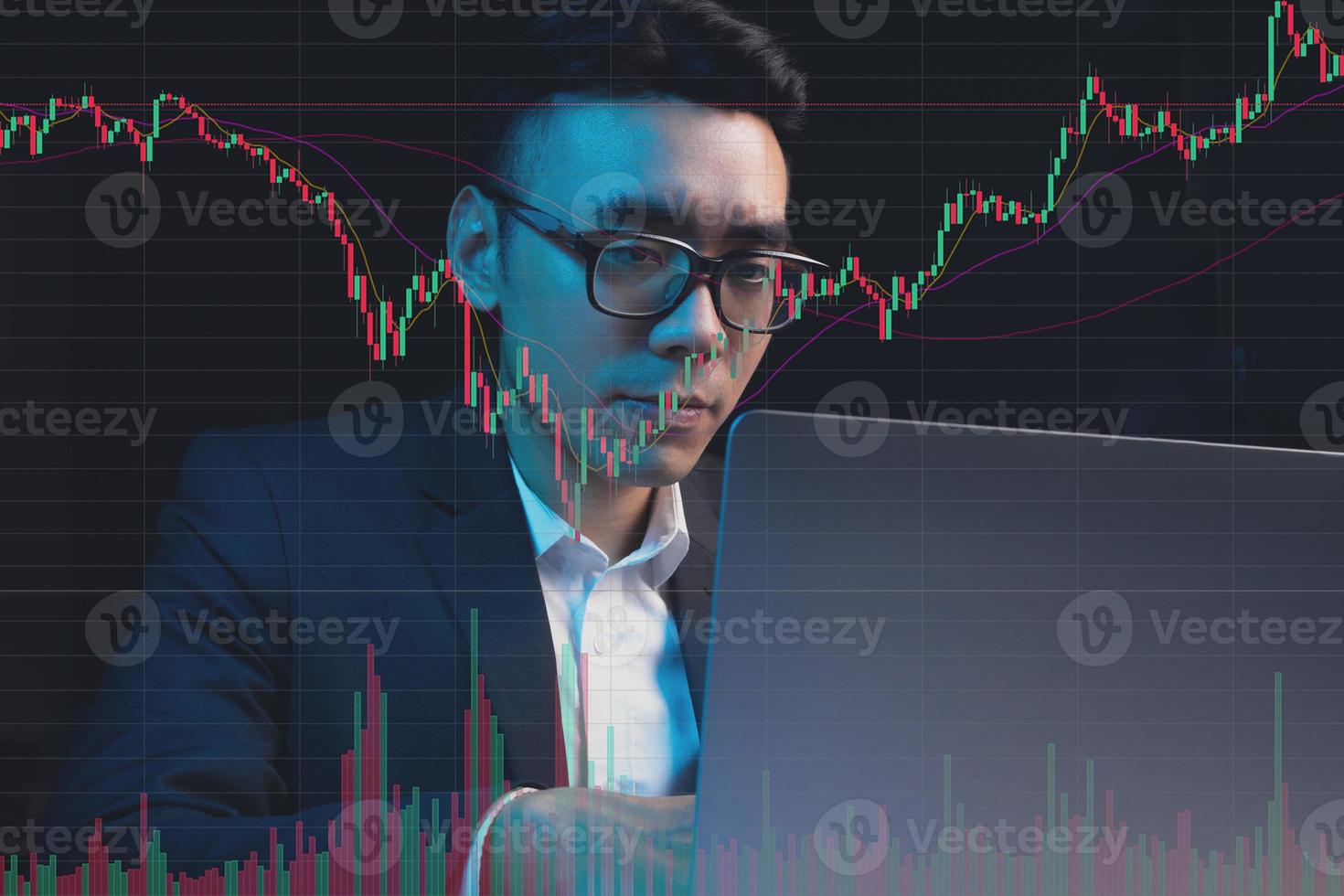 Portrait of Asian businessman studying stock market photo