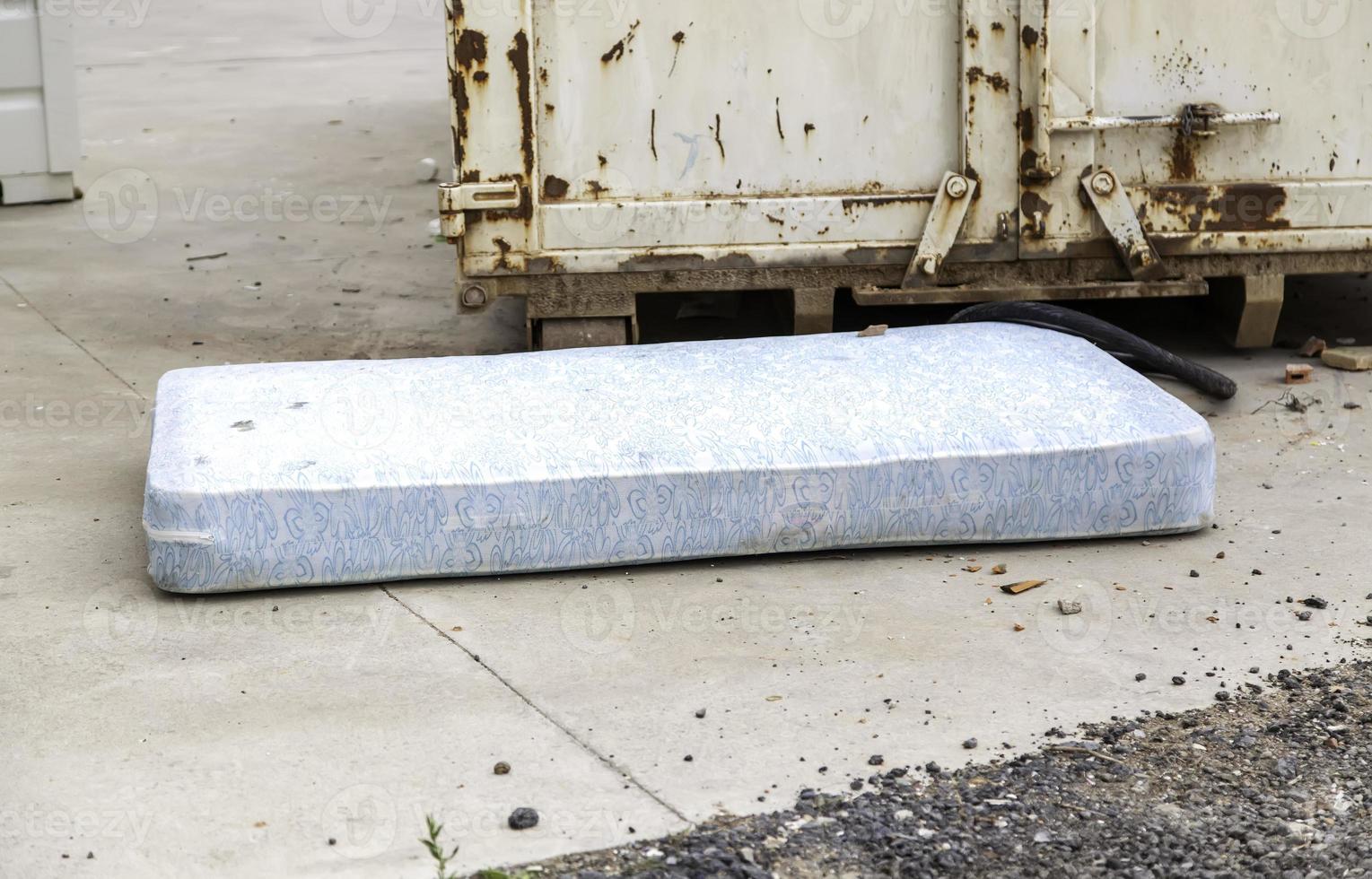Dirty and abandoned mattress photo