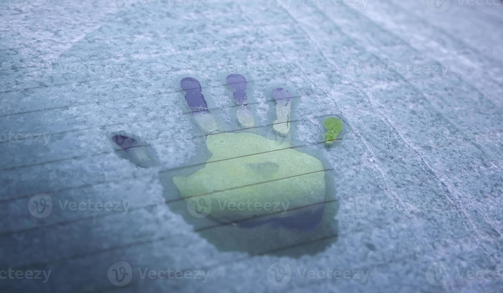 Handprint on frozen glass photo