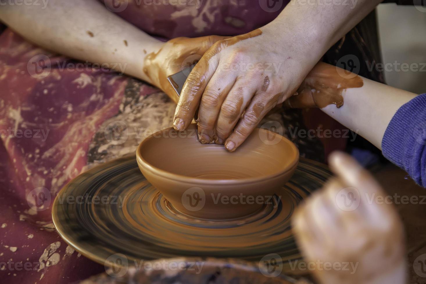 Craftsman working clay photo