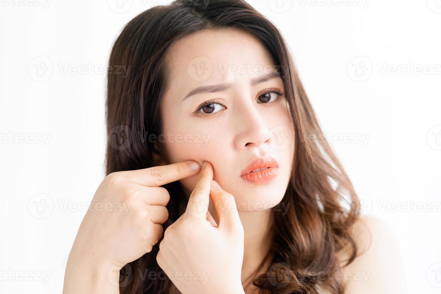 Asian woman sitting makeup in front of mirror photo