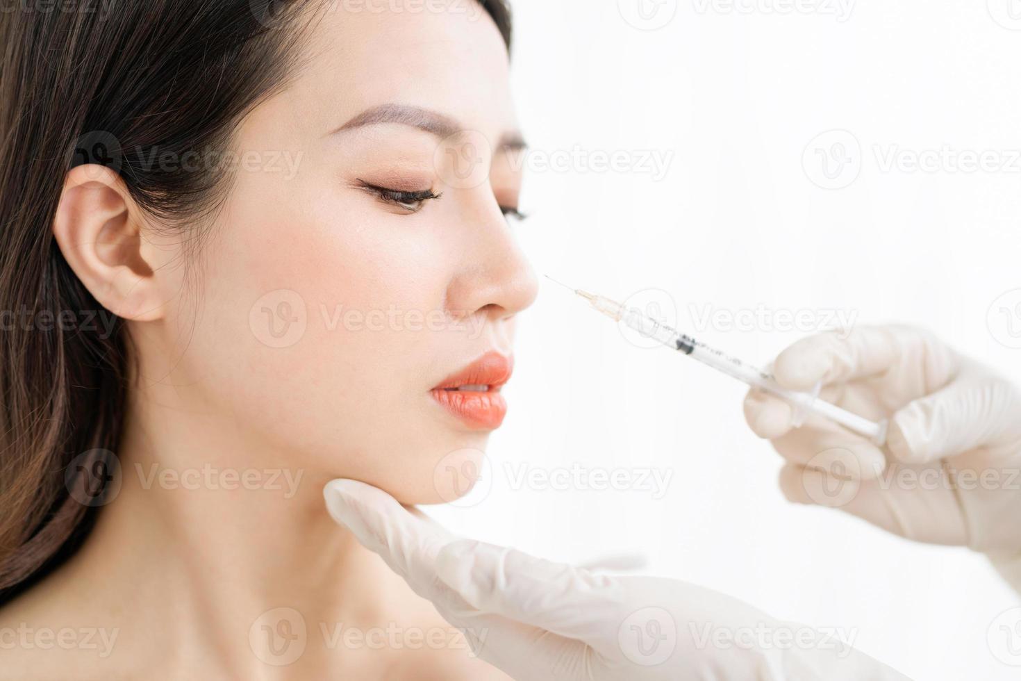 Asian woman undergoing fine carpet surgery photo