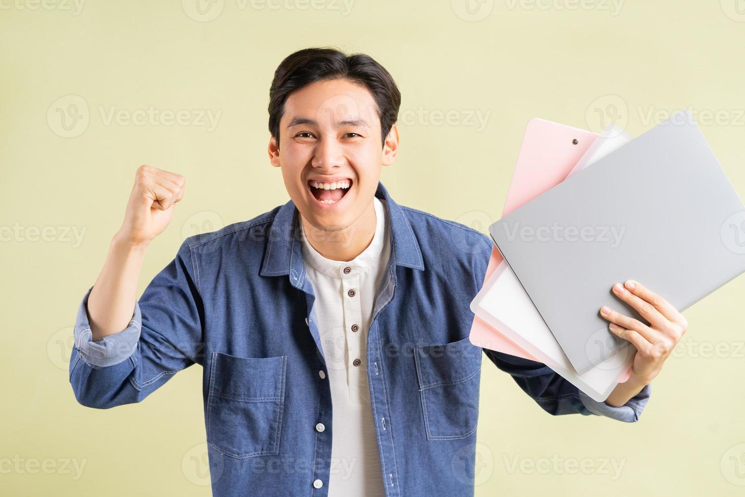 The photo of the handsome Asian businessman showing a successful expression