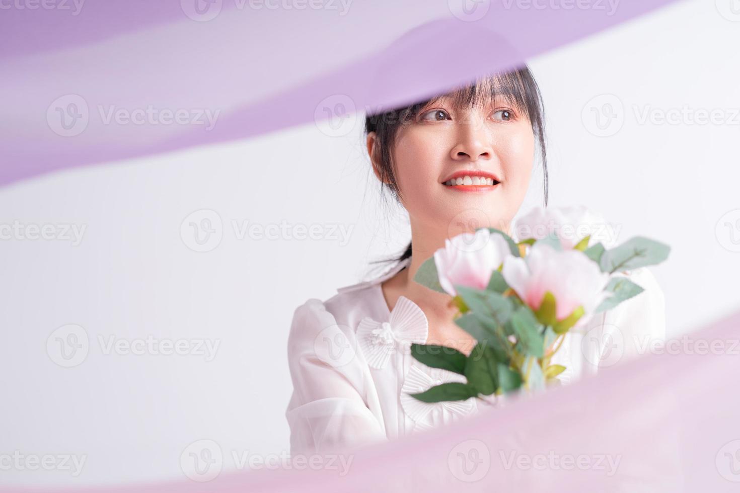 Portrait photo of a beautiful Asian woman with flowers