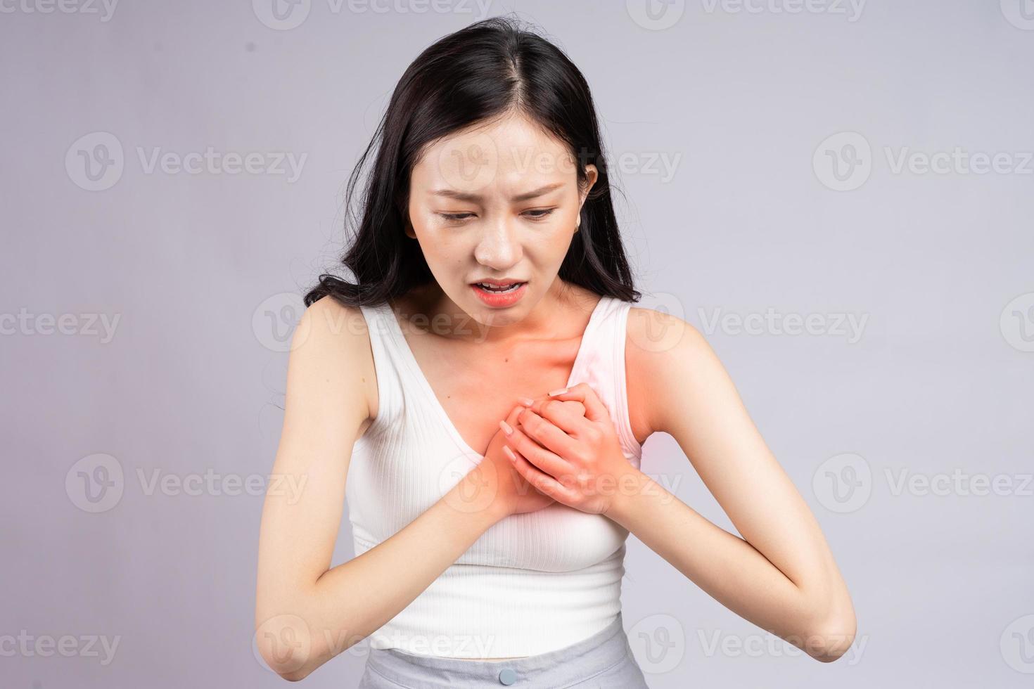 Asian woman having a heart attack photo