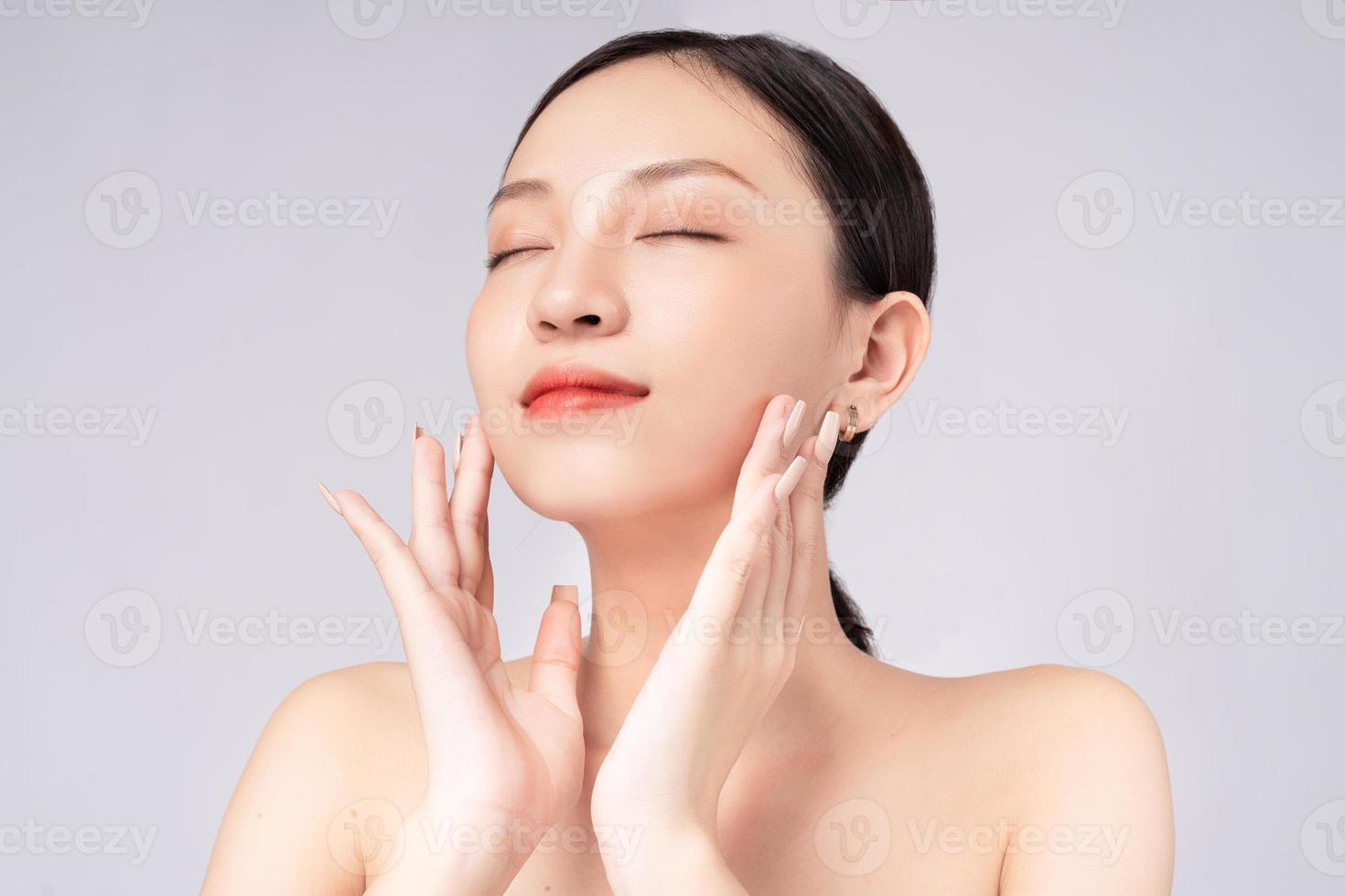 Beautiful Asian woman feels happy with beautiful healthy skin photo