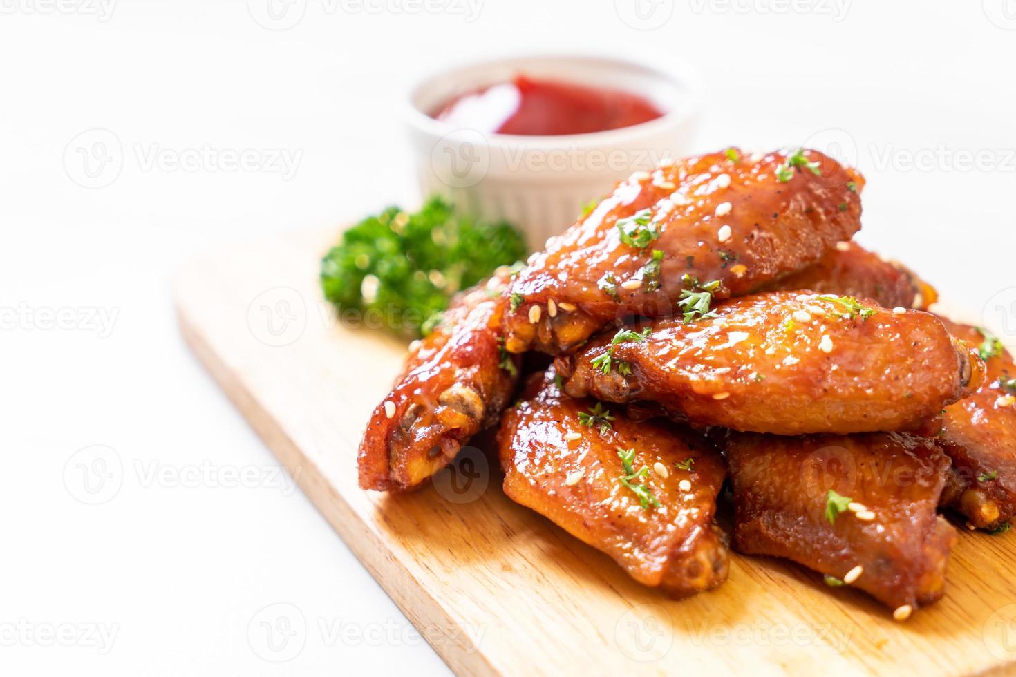 Baked barbecue chicken wings with white sesame photo