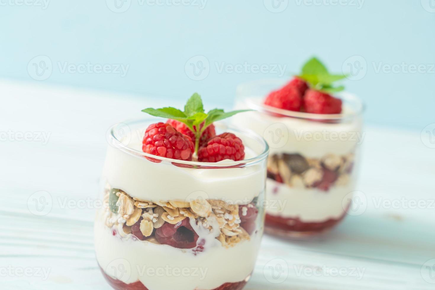 Fresh raspberry and yogurt with granola - Healthy food style photo