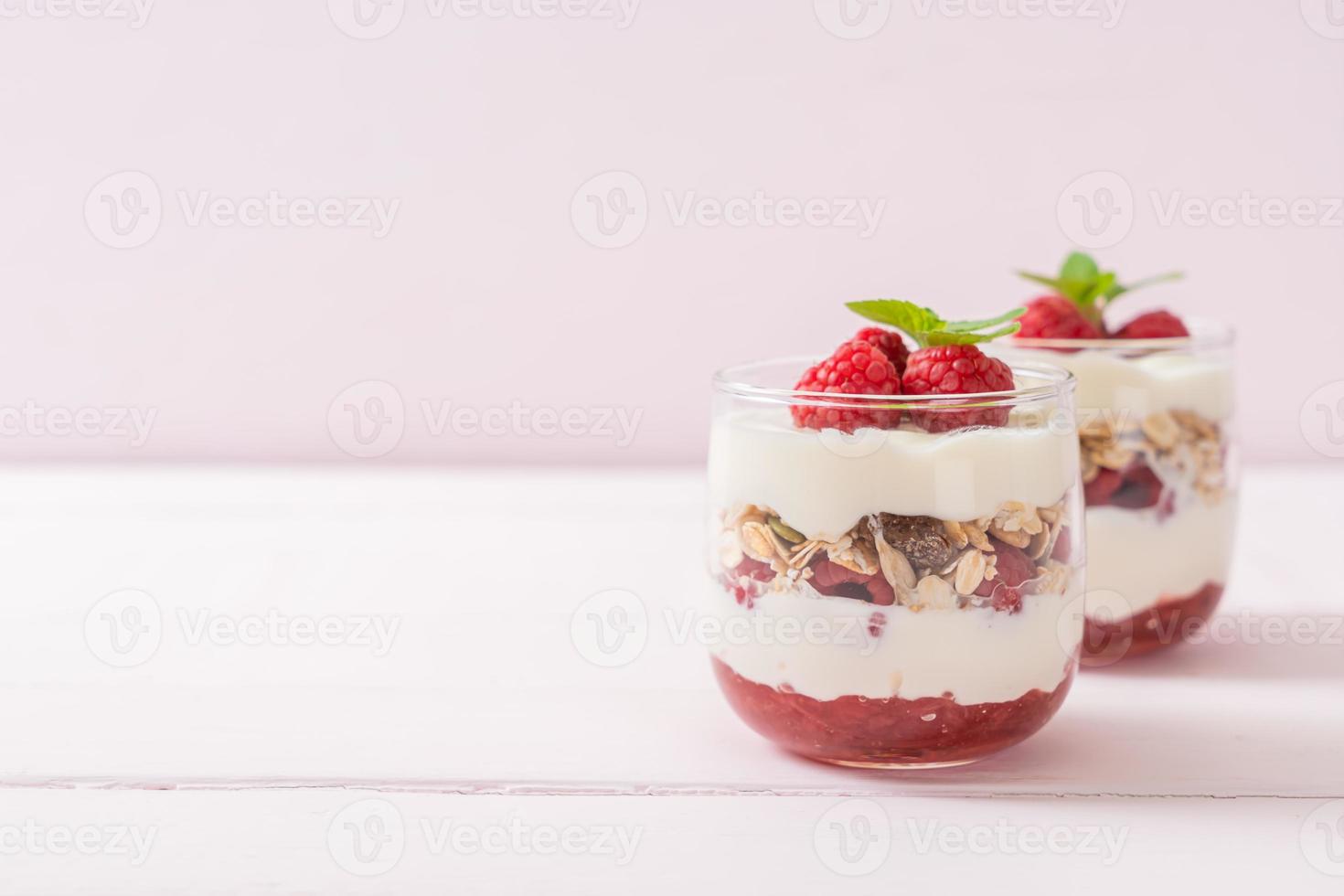 Fresh raspberry and yogurt with granola - Healthy food style photo