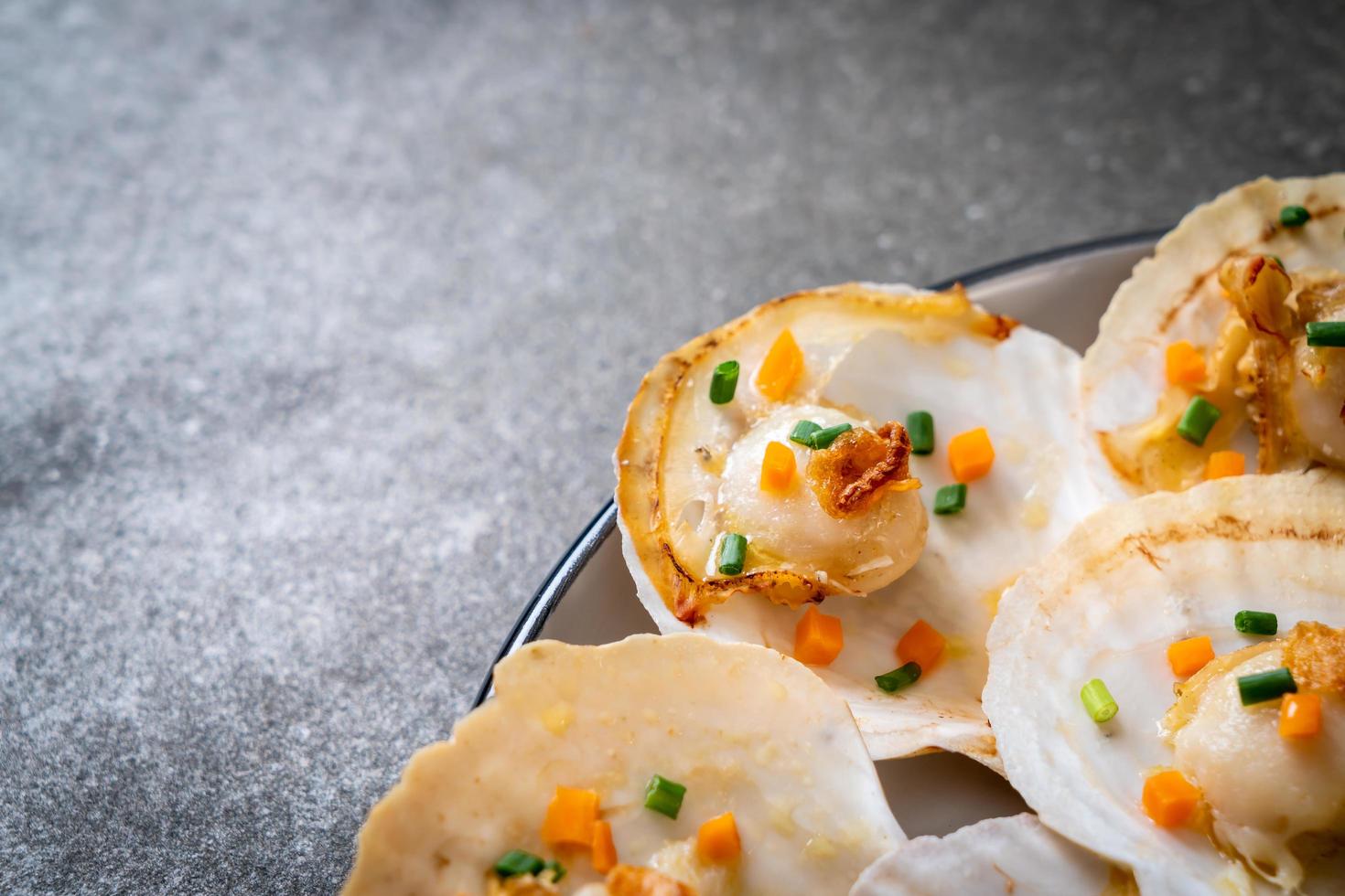 Grilled scallops shell with butter and garlic photo