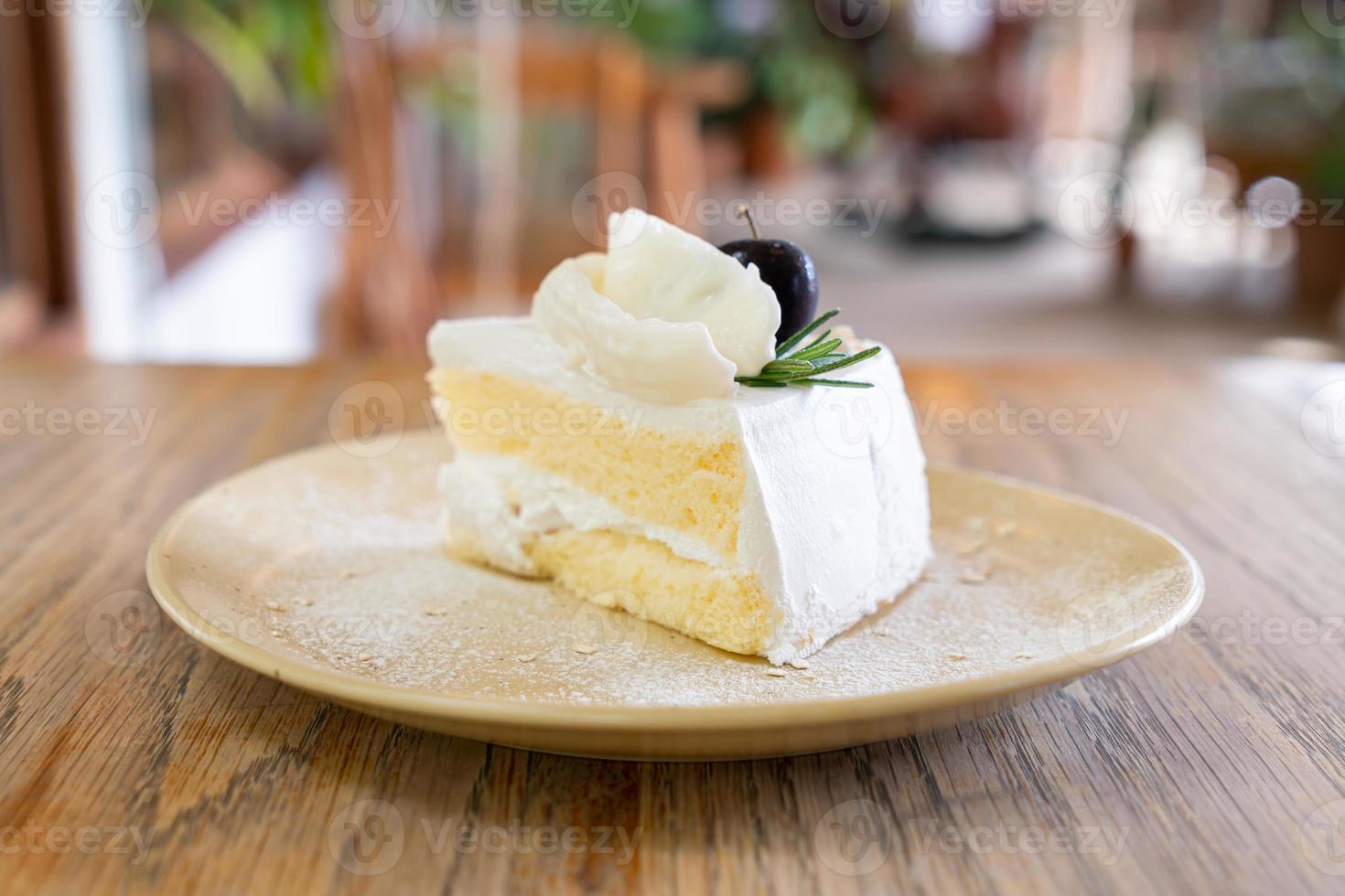 Coconut cake on plate in cafe and restaurant photo