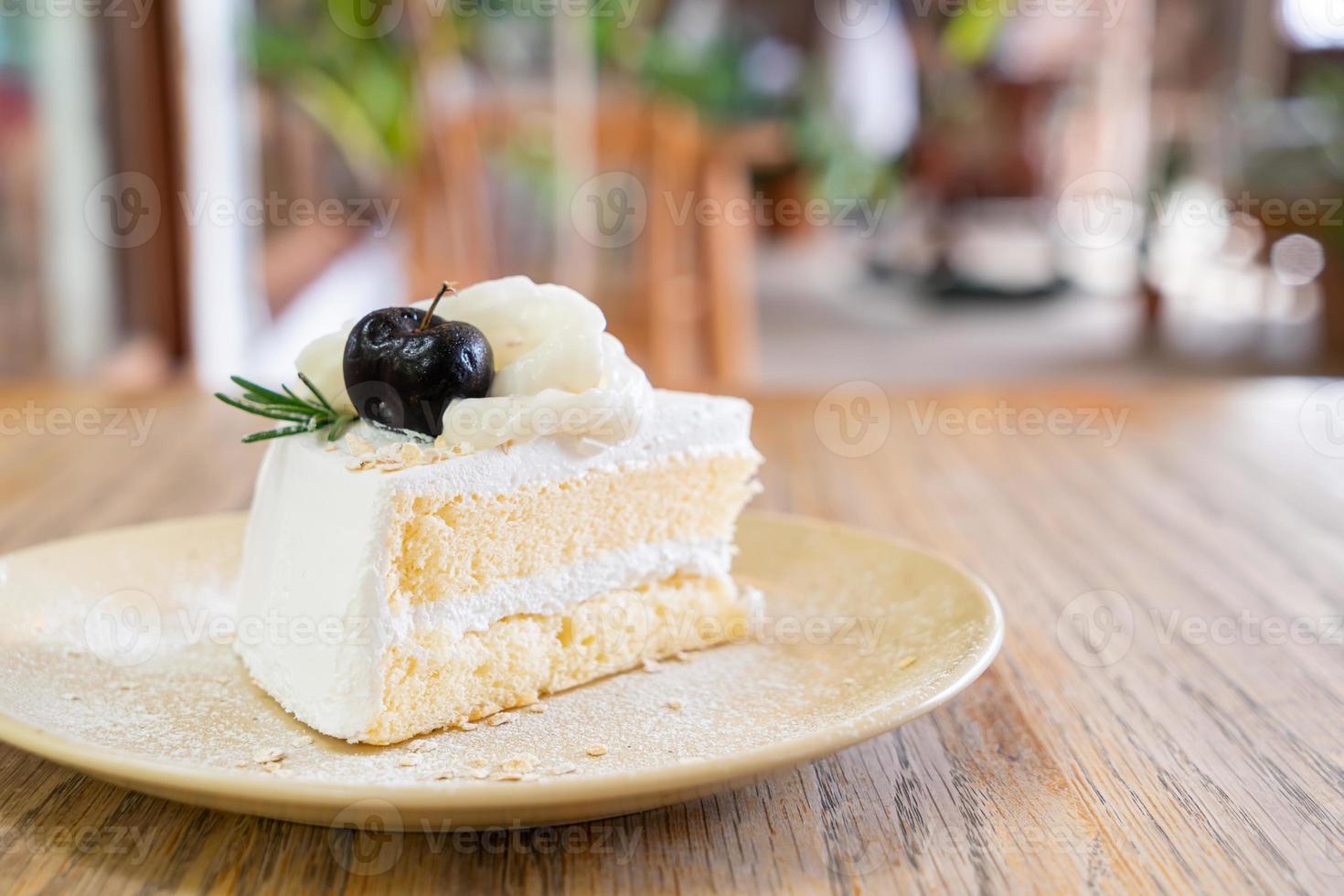 Coconut cake on plate in cafe and restaurant photo
