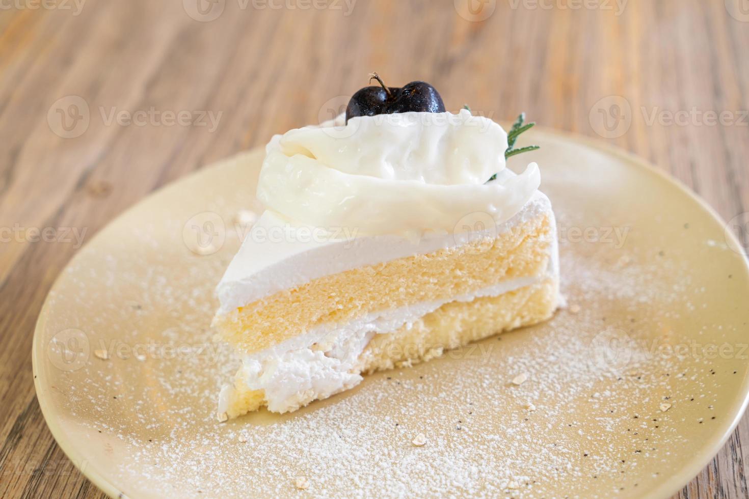 Coconut cake on plate in cafe and restaurant photo