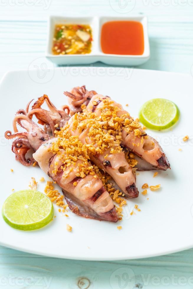 Fried squid with garlic - seafood style photo
