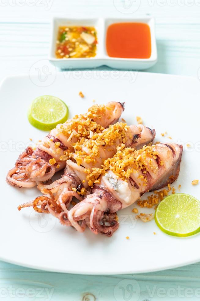 Fried squid with garlic - seafood style photo