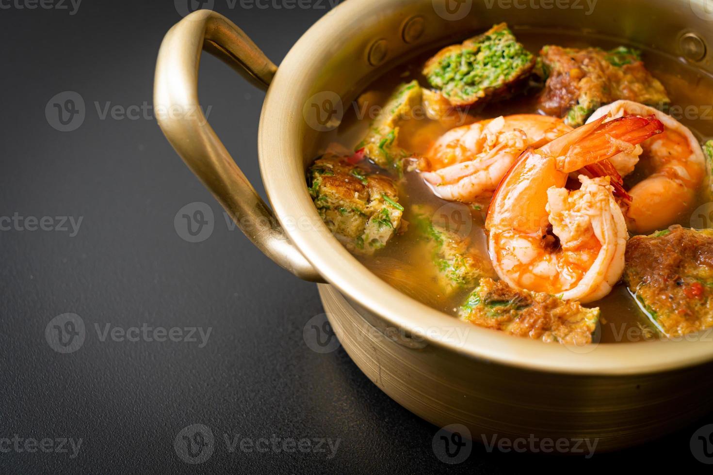 Sour soup made of Tamarind Paste with Shrimps and Vegetable Omelet photo