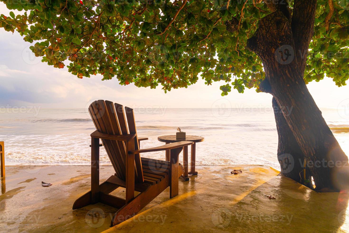 Empty wooden chairs with beach sea background photo