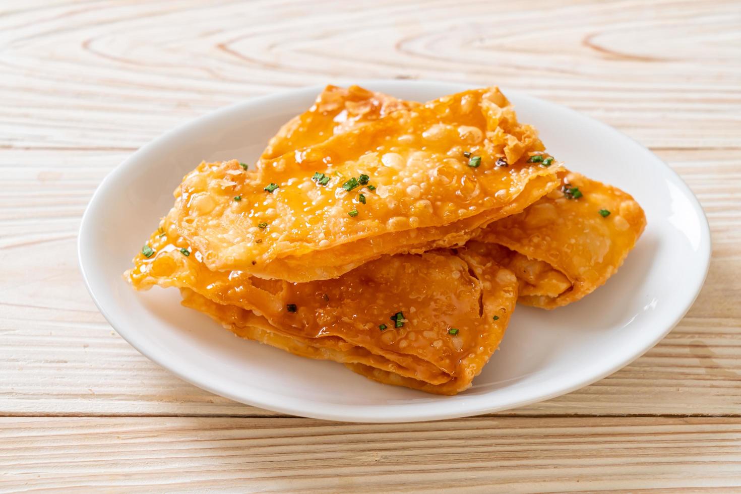 Crispy roti with sugar on plate photo