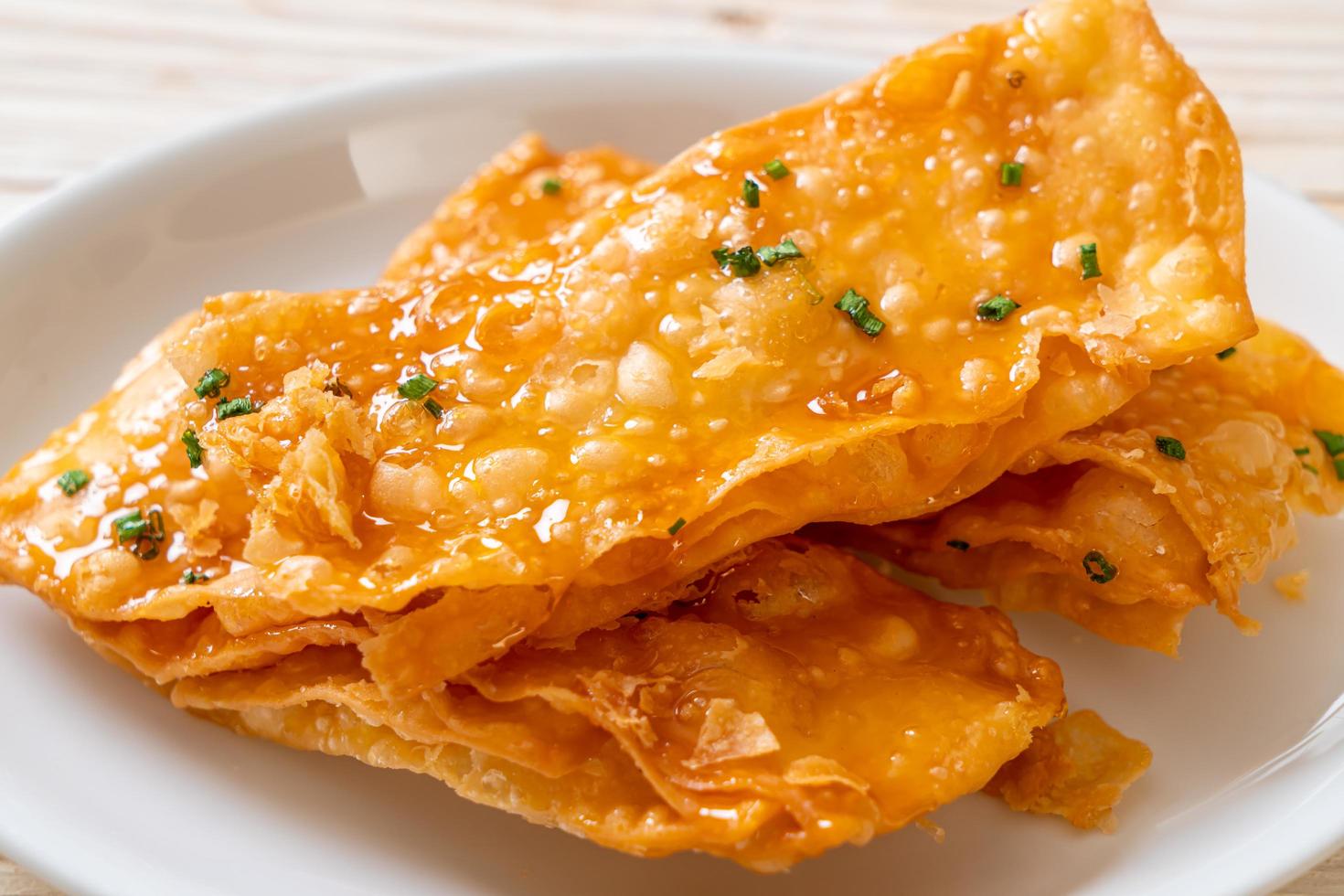 Crispy roti with sugar on plate photo