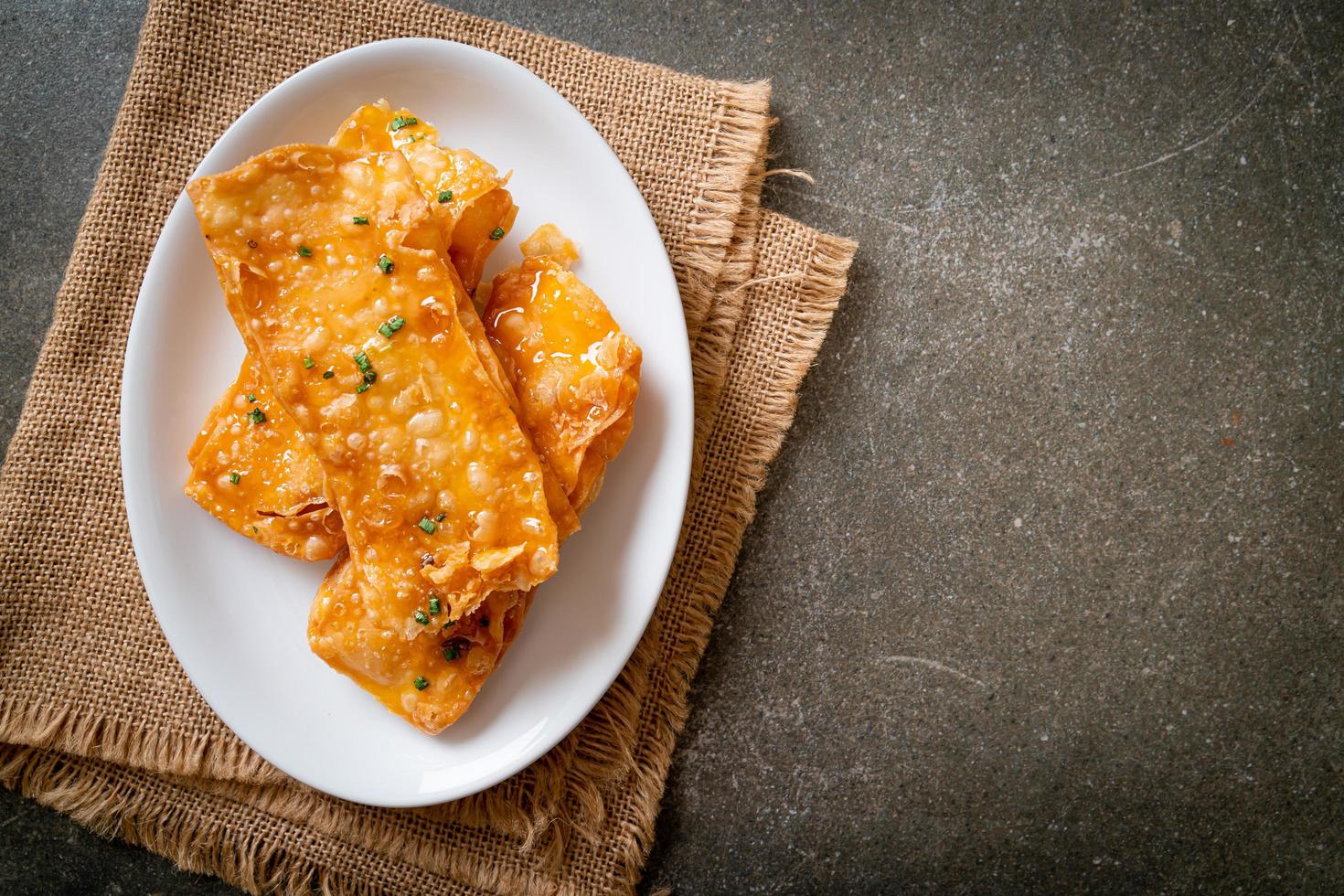 Crispy roti with sugar on plate photo