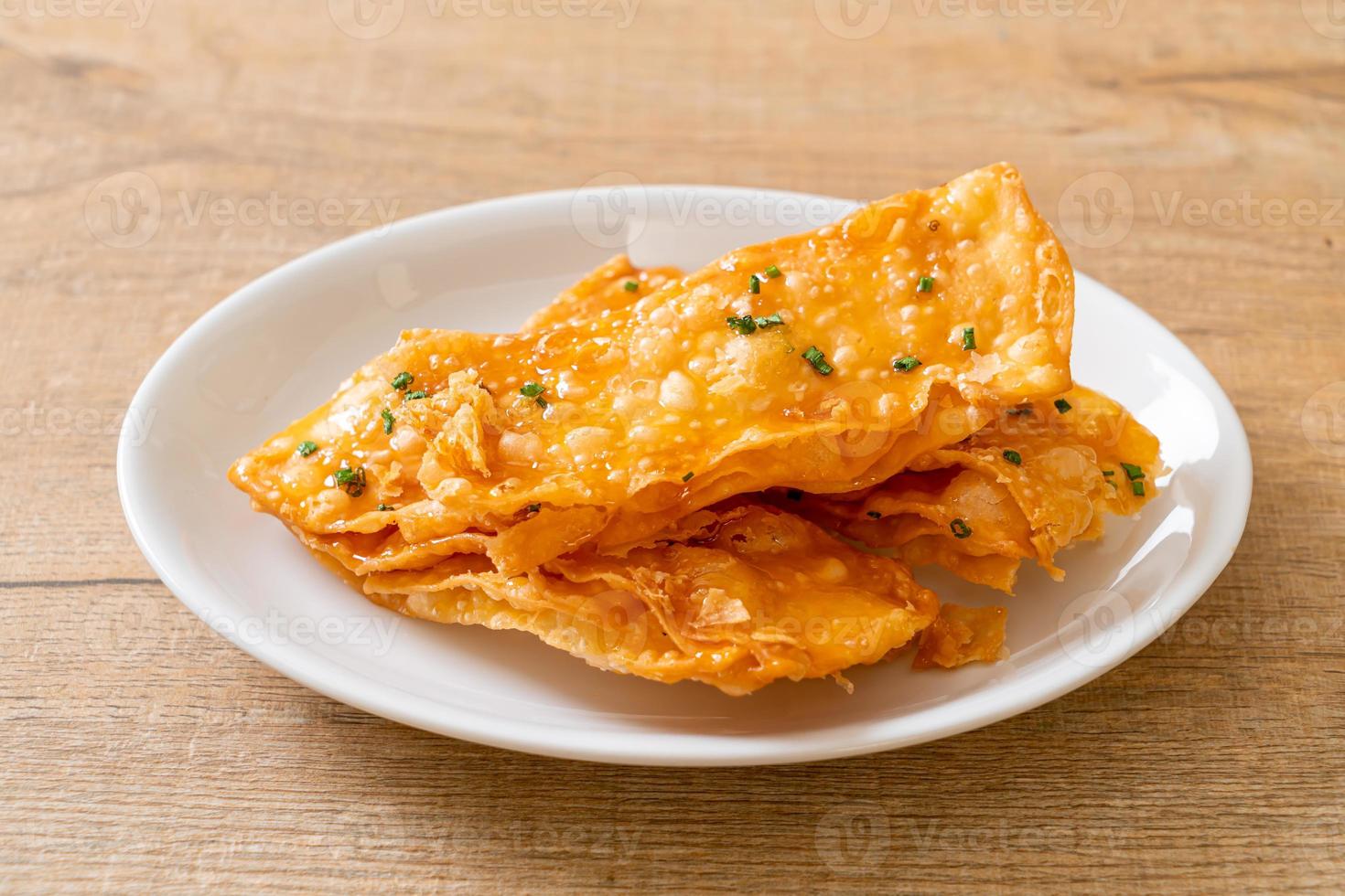 Crispy roti with sugar on plate photo