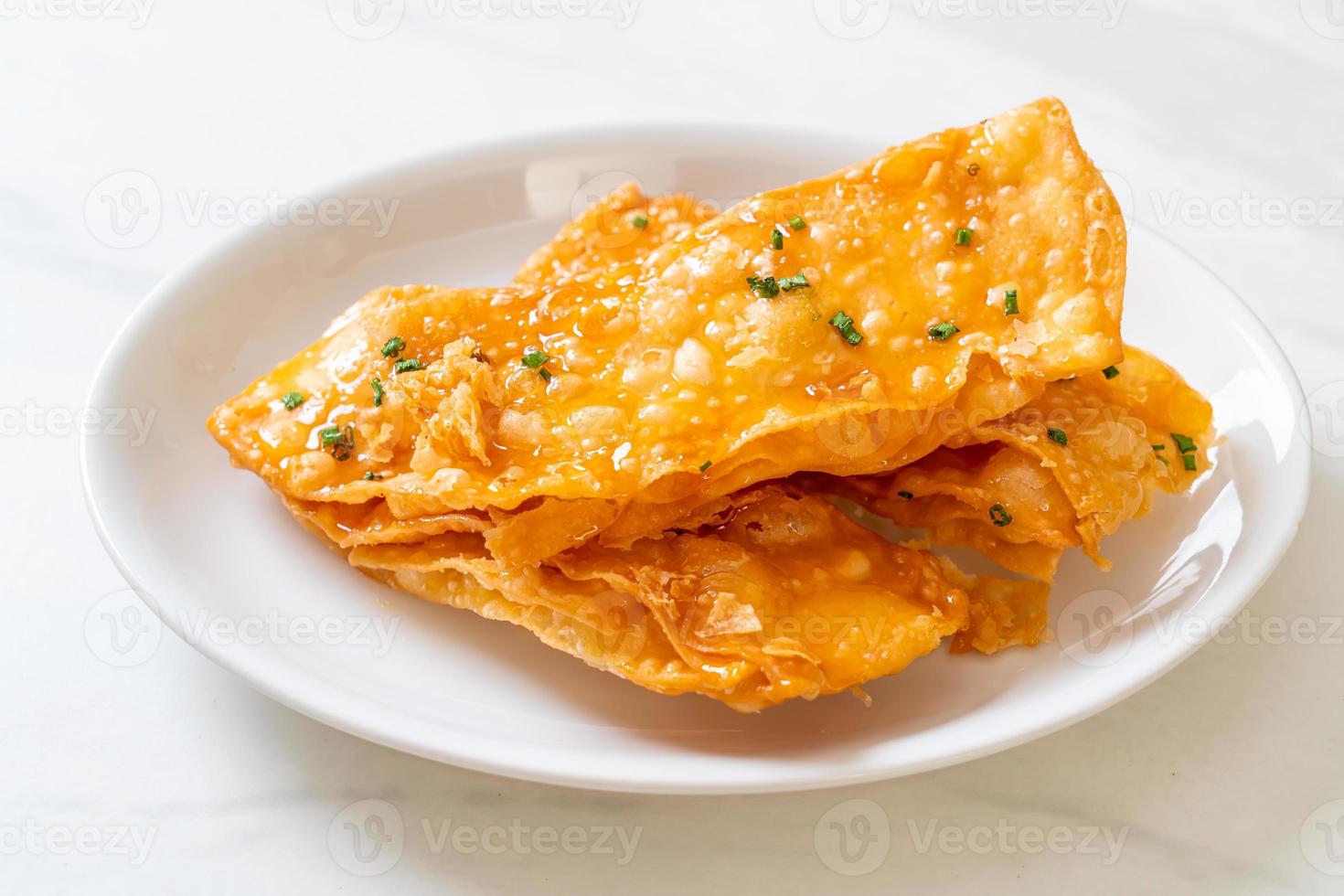 Crispy roti with sugar on plate photo