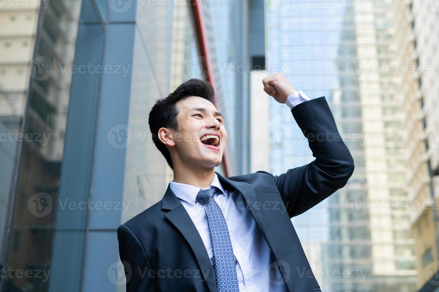 Portrait of young Asian businessman outside the office photo