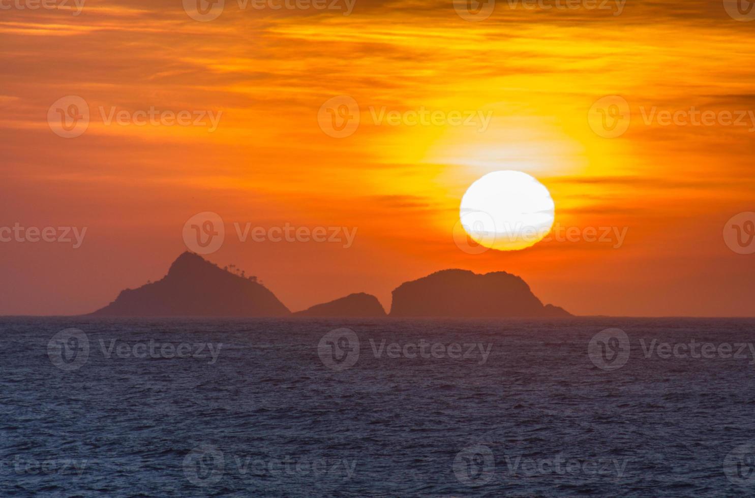Sunset on the beach of Ipanema photo