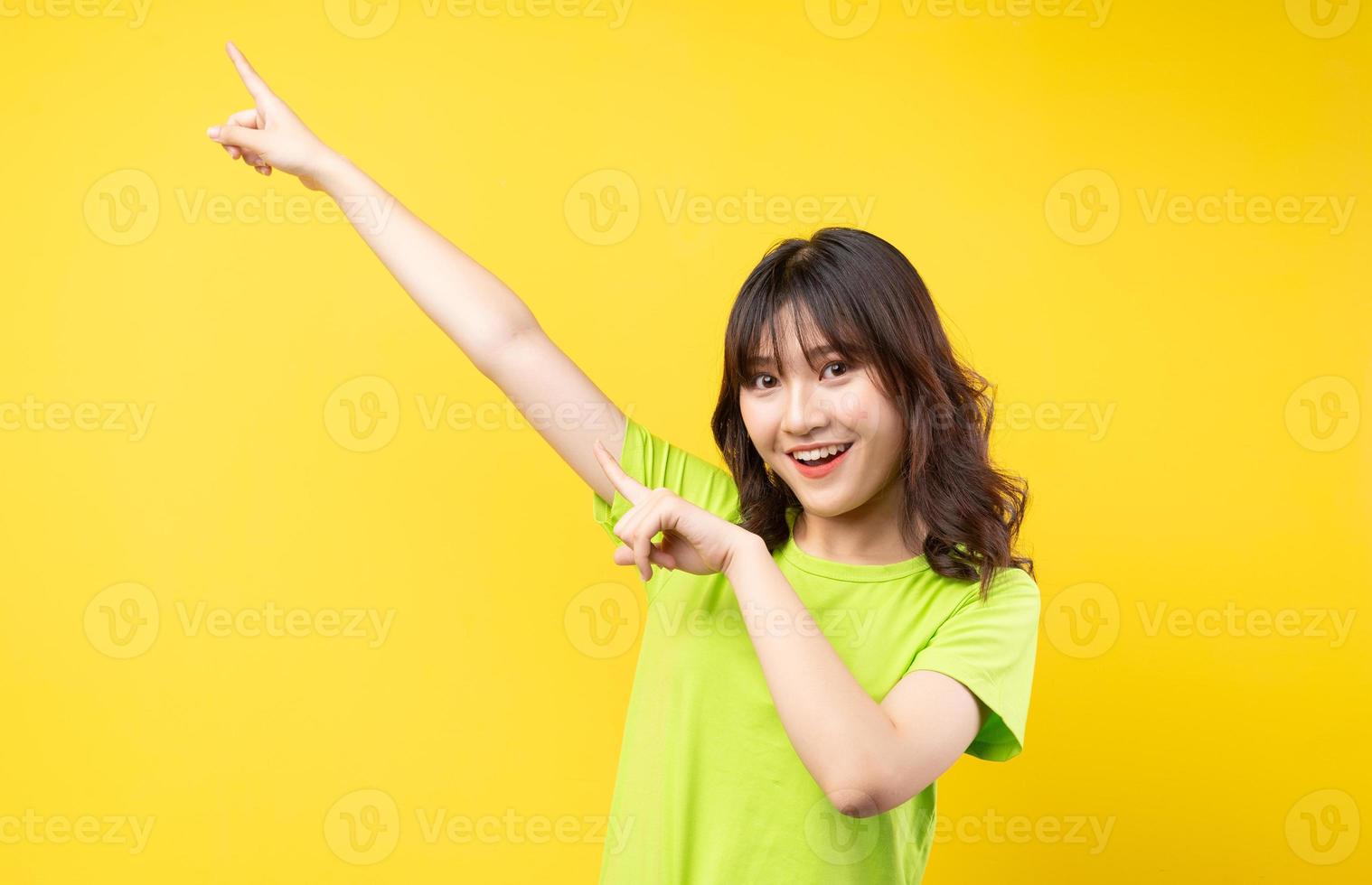 Young Asian girl with expressions and gestures on background photo