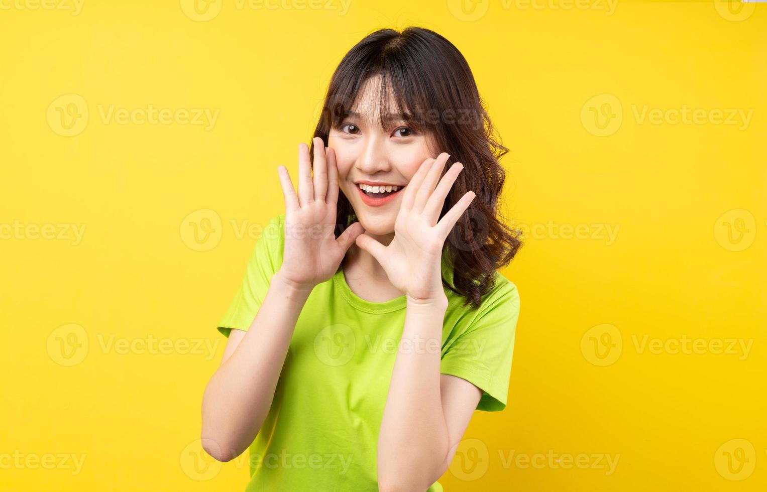 Young Asian girl with expressions and gestures on background photo