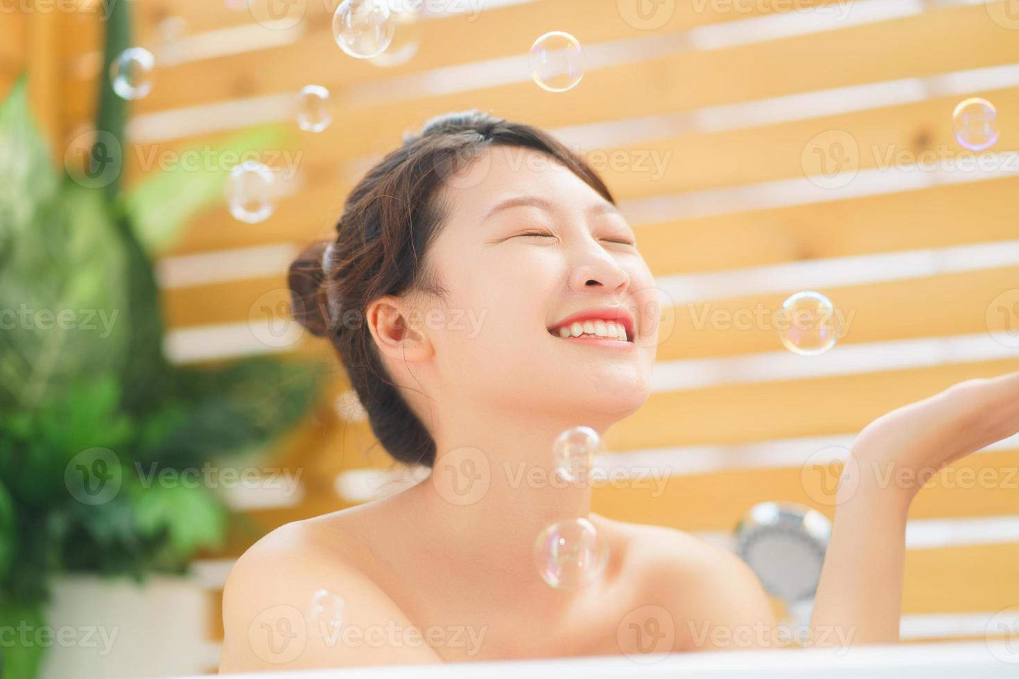 Woman relaxing in the bathroom photo