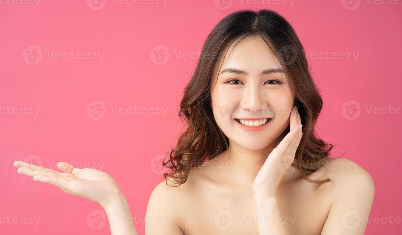 Beautiful woman is taking care of her skin photo