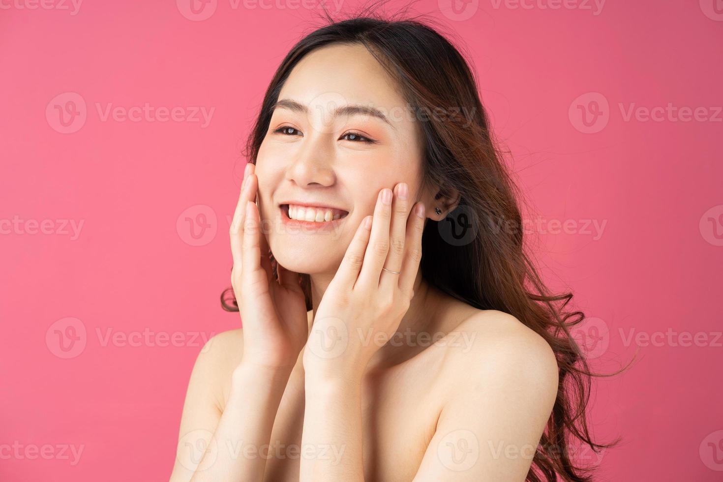 Beautiful woman is taking care of her skin photo