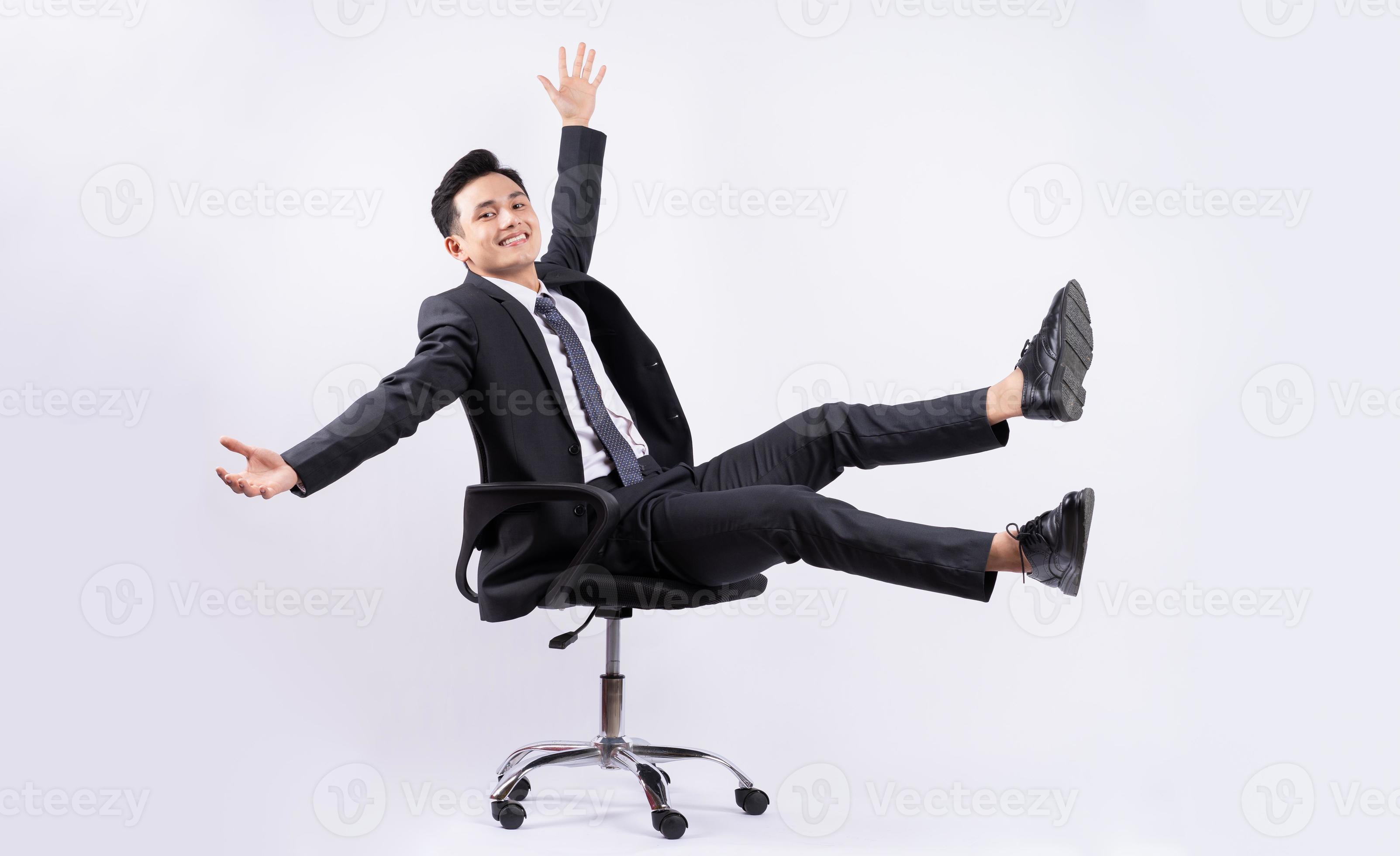 Young Asian businessman sitting on chair on white background 2876755 Stock  Photo at Vecteezy