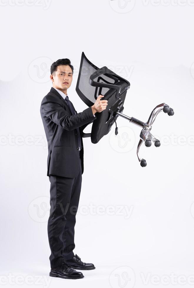 Image of young Asian businessman wearing suit on white background photo